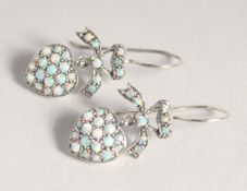 A PAIR OF SILVER OPAL SET HEART SHAPED EARRINGS.