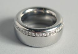 A GOOD DESIGNER TITANIUM AND DIAMOND RING
