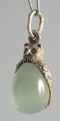 A RUSSIAN SILVER AND JADE OWL PENDANT.