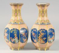 A PAIR OF BLUE AND YELLOW CHINESE OCTAGONAL VASE. 10in high.