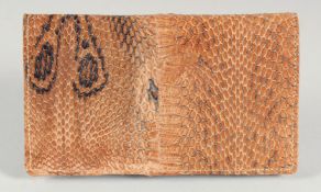 A 1940's - 1950's SNAKESKIN PURSE. 6.5ins long, 3.75ins deep.