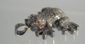 A DIAMOND SET FROG PENDANT.