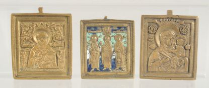 THREE SMALL BRASS AND ENAMEL ICONS. 2.25ins x 2ins.