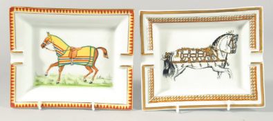 TWO HERMES OF PARIS PORCELAIN ASHTRAYS DECORATED WITH HORSES. 7ins & 6ins.