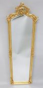 A DECORATIVE GILTWOOD TALL MIRROR. 5ft 10ins high x 1ft 8ins wide.