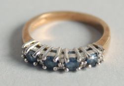 A 9CT GOLD SAPPHIRE AND DIAMOND RING.