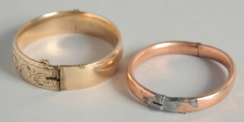 A 9CT GOLD BANGLE, 11gms and a gold coloured bracelet. (2).