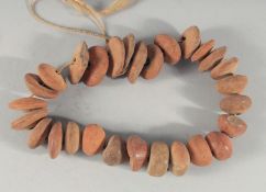 A STING OF ANTIQUITY TERRACOTTA BEADS.