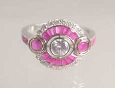 A SILVER AND FAUX RUBY C Z DECO STYLE RING