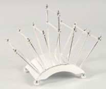 A CHRISTOPHER DRESSER DESIGN SILVER PLATED SIX DIVISION TOAST RACK.