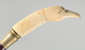 A CARVED BONE HANDLE WALKING STICK 