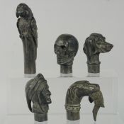 FIVE VARIOUS BRONZE WALKING STICK HANDLES.