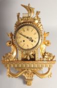 A SCANDINAVIAN GILT WALL CLOCK. 22ins long.
