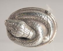 A SILVER SNAKE VESTA.