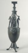 A GOOD LARGE BRONZE GRAND TOUR EWER with Egyptian figure and horses on a stand with three claw feet.