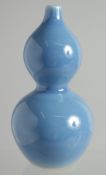 A SMALL CHINESE BLUE DOUBLE GOURD VASE 4.25ins high.