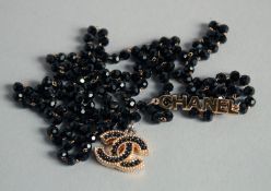 A CHANEL BEAD NECKLACE.