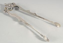 A PAIR OF SILVER SUGAR TONGS