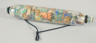 A DECOUPAGE ROLLING PIN. 15ins long.