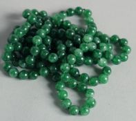 A STRING OF JADE BEADS
