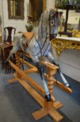 A GOOD LARGE DAPPLE GREY ROCKING HORSE on a pine base.