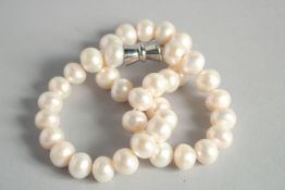 A LONG STRING OF LARGE PEARLS.
