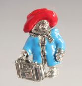 A SILVER AND ENAMEL PADDINGTON BEAR BROOCH.