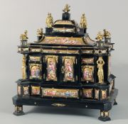 A SUPERB 19TH CENTURY VIENNA EBONY AND ENAMEL CASKET fitted with numerous enamel fronted drawers and