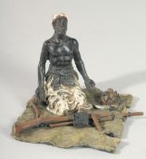 A VIENNA PAINTED COLD CAST BRONZE GROUP, a man with a gun. 4ins high.
