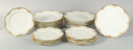 A SET OF FOURTEEN LIMOGES PORCELAIN WHITE AND GILT 9 INCH PLATES AND TEN 8 INCH PLATES. (22).