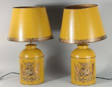 A PAIR OF CHINESE DESIGN YELLOW TOLEWARE LAMPS AND SHADES. 28ins high including shades.