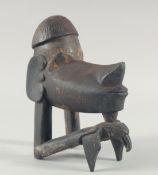 A CARVED WOOD TRIBAL HAND. 9ins high.