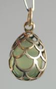A RUSSIAN SILVER AND JADE EGG PENDANT.