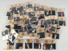 A BAG OF MACINTOSH ENAMEL NECKLACES.