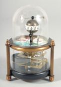 A SMALL GLASS DOMED FISH CLOCK. 5ins high.