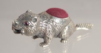 A SILVER BEAVER PIN CUSHION.