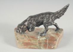 A SMALL BRONZE RETRIEVER on a marble base. 4.5ins long.