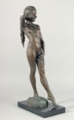 A GOOD BRONZE STANDING FEMALE NUDE Signed on a marble base.