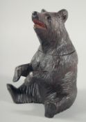 A NICE BLACK FOREST CARVED BEAR CADDY with hinged head. 8ins high.