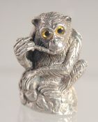 A SILVER MONKEY PIN CUSHION..