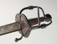 AN 18TH CENTURY STEEL SWORD with hand and engraved blade. 36ins long.