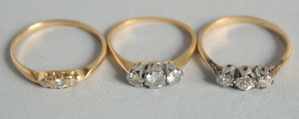 THREE GOLD AND DIAMOND RINGS, 9ct and 18ct gold.