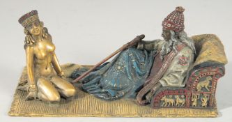 A VIENNA PAINTED COLD CAST BRONZE GROUP, Arab and nude. 7ins long.