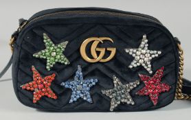 A GUCCI LIMITED EDITION BLACK VELVET BAG with six coloured stars with long leather strap. No. 467632