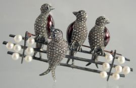 A DIAMOND AND PEARL BROOCH THREE BIRDS ON A FENCE.