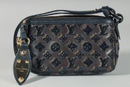 A LOUIS VUITTON SPARKLY EVENING BAG. 8ins long, 5ins deep.