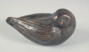 A SMALL BRONZE OF A BIRD Signed, 4ins long.