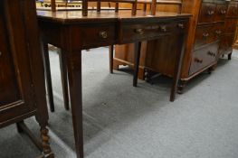 A mahogany breakfront three drawer side table.
