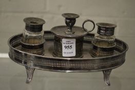 A good plated desk stand with inkwells and taper holder.