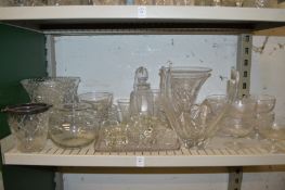 Cut glass vases, sundae glasses and other glassware.